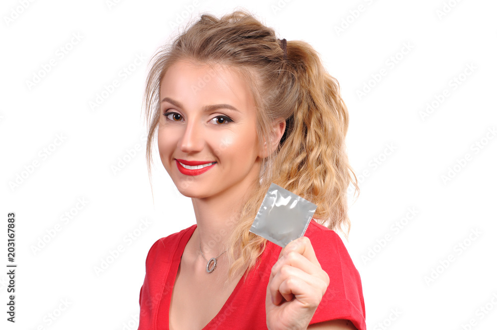 Beautiful girl is holding a condom Beautiful girl is holding a condom