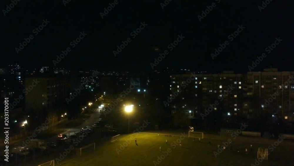 shooting with quadcopter, review on the city football field at night. shooting with quadcopter, review on the city football field at night.
