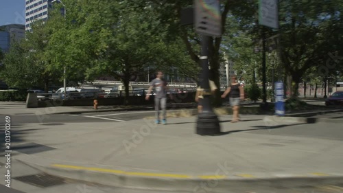 Right Front Three Quarter view of a Driving Plate: Car travels on SW Naito Parkway in Portland, Oregon from SW Stark Street and turns right onto Morrison Bridge going east. It crosses bridge and transitions onto northbound Interstate 5, continues to Exit 302A, leaves the interstate, and yields to cross traffic at NE Weidler Street. photo