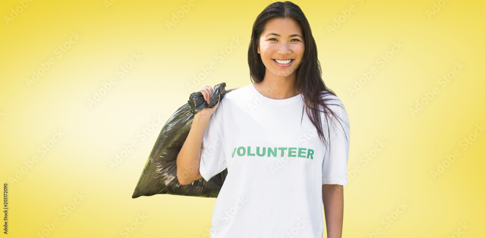 Team of volunteers picking up litter in park against yellow vignette Team of volunteers picking up litter in park against yellow vignette