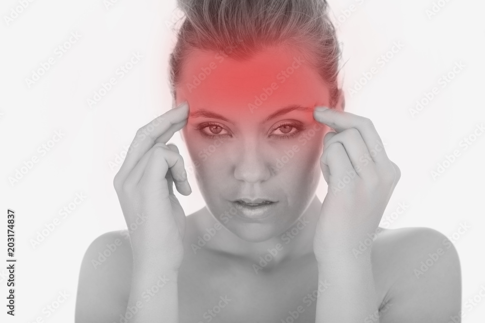 Portrait of young woman massaging her temples over white background Portrait of young woman massaging her temples over white background