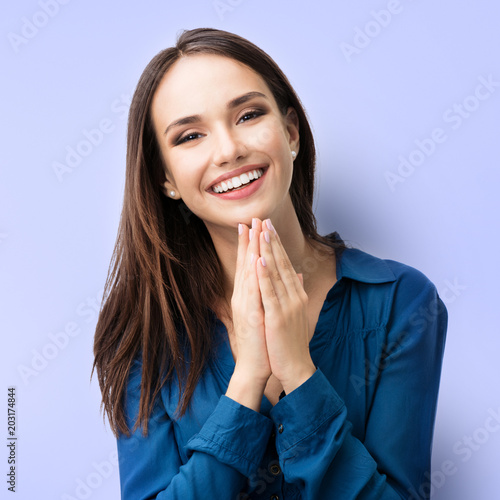 Happy gesturing smiling young woman