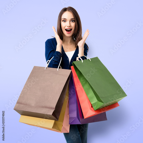 Woman in casual clothing with shopping bags
