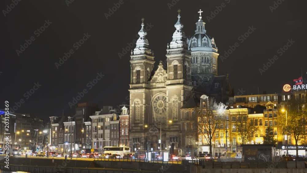 a night shot of basilica st nicholas in amsterdam, netherlands a night shot of basilica st nicholas in amsterdam, netherlands