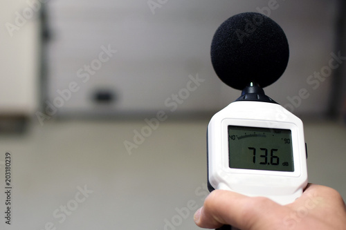 Sound level meter measuring the noise. Space for text.