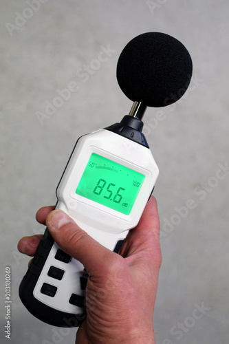 Plakat Hand holding sound level meter