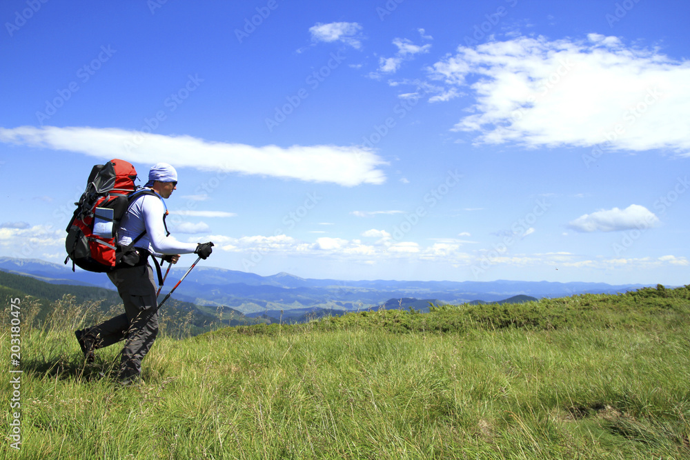 Summer hike in the mountains with a backpack and tent. Summer hike in the mountains with a backpack and tent.