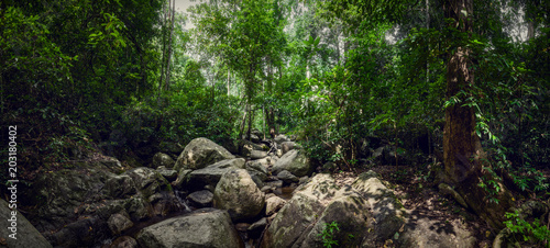 Waterfall Chan Ta Then in the jungles of Thailand. Big panorama. Boulders in the forest.