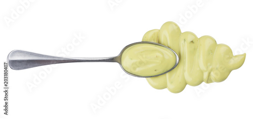 Foto Garlic sauce with spoon isolated on white background. Top view