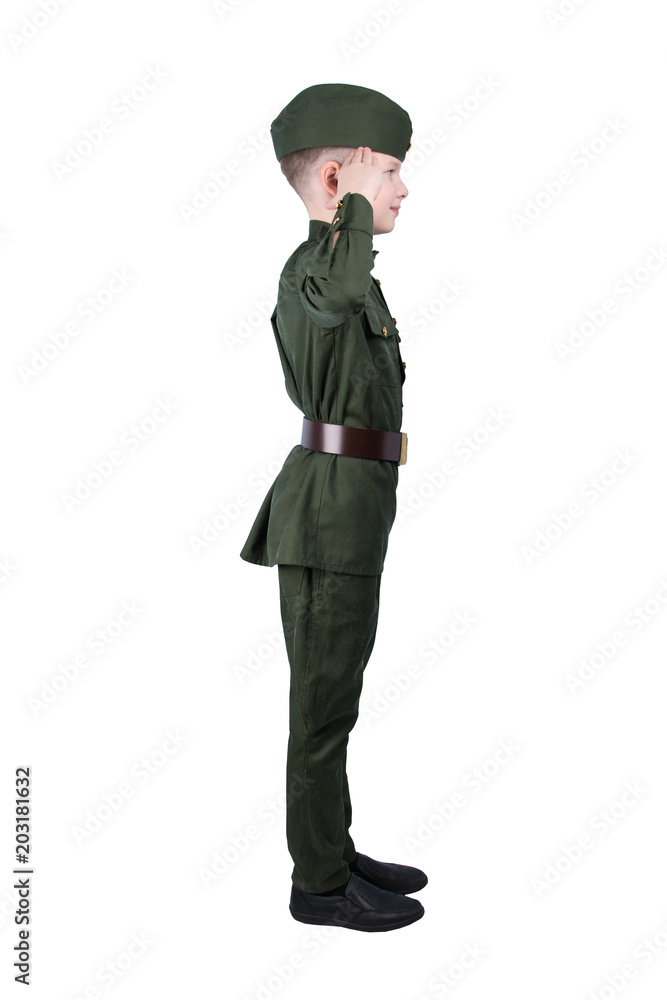 boy stands sideways in military uniform greets, puts his hand to his head isolated on white boy stands sideways in military uniform greets, puts his hand to his head isolated on white