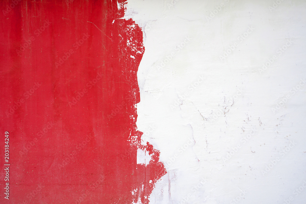 The texture of the wall is half white, half red. - obrazy, fototapety, plakaty 