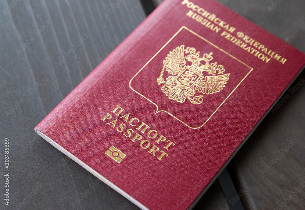 The red passport of the Russian Federation on a gray background The red passport of the Russian Federation on a gray background