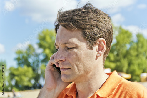 Man in orange clothes photo