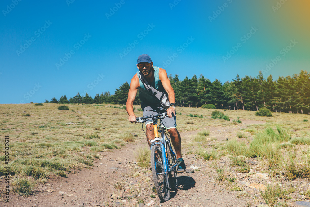 Young man rides a bicycle Young man rides a bicycle