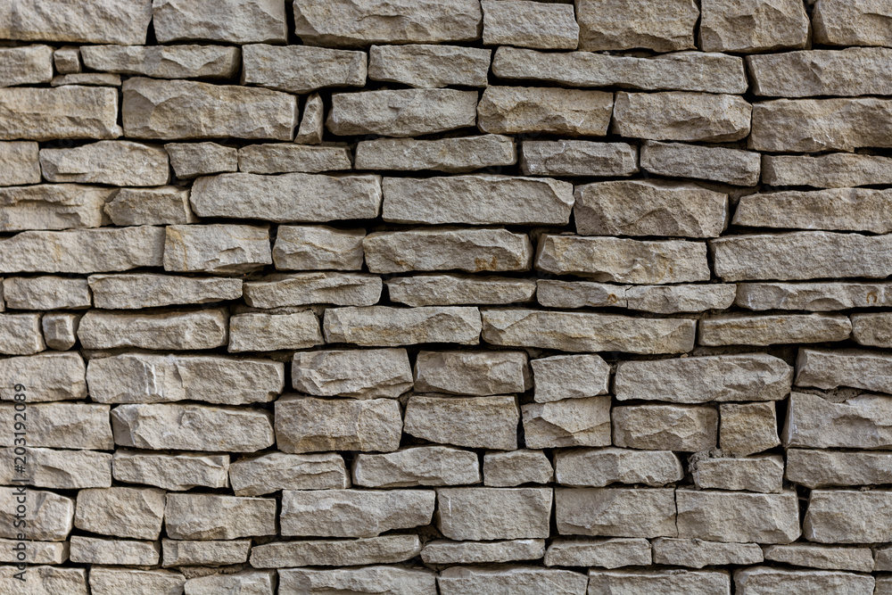 a wall of many limestone blocks of gray color