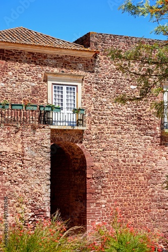 View of the city gate building (Torreao das Portas da Cidade) in the city centre, Silves, Portugal. photo