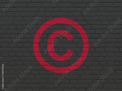 Law concept: Painted red Copyright icon on Black Brick wall background
