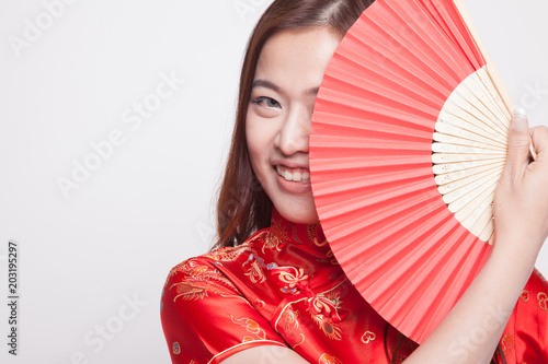 Asian girl in red chinese cheongsam dress