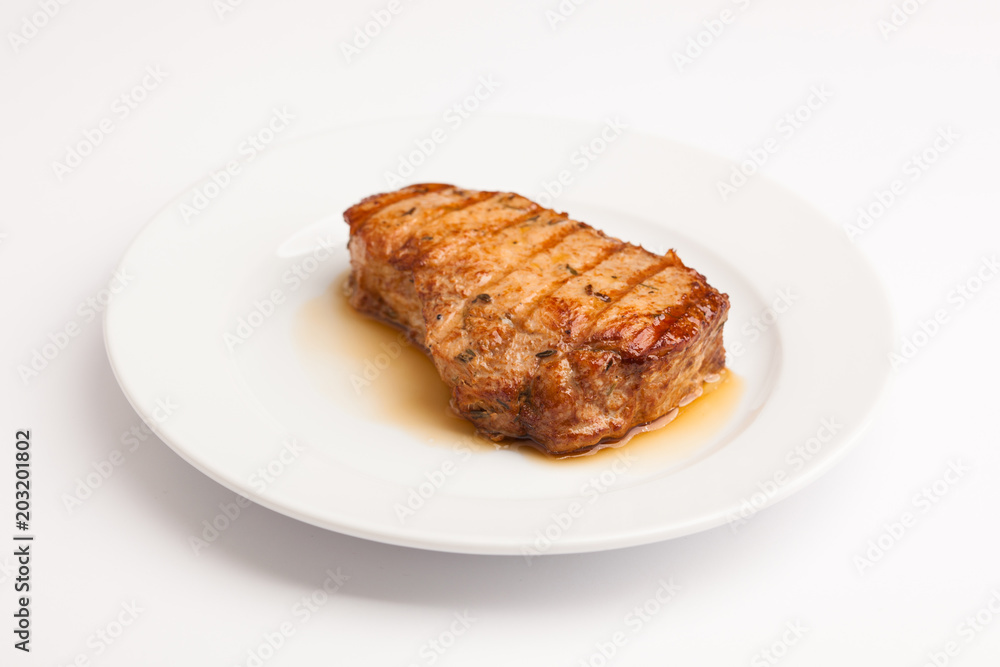 A beautiful photo of a closeup menu of fresh tasty steak on a plate on a white background