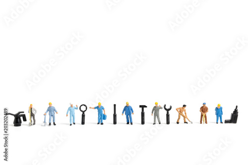 Miniature people   Worker team with tools supplies on white background