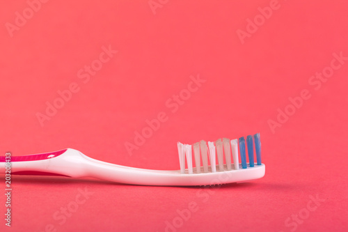 Toothbrush on red background