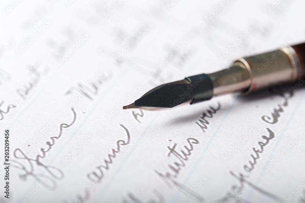 Fountain pen on an antique handwritten letter Fountain pen on an antique handwritten letter