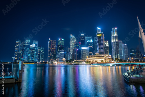 Singapore Skyline and view of skyscrapers on Marina Bay at twilight time. © nuttawutnuy