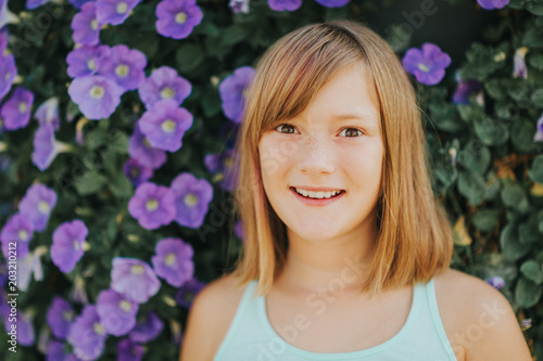 Sweet and emotional preteen girl, outdoor summer portrait © annanahabed