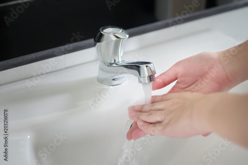 happy woman handwash; closeup hand portrait of asian woman washing her hand, concept of hygiene, hygienic hand wash, body care, skin care, clean health care; asian young adult woman hand model