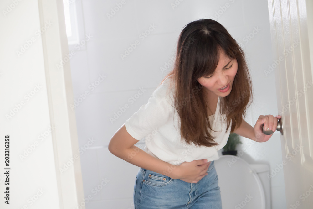 woman with diarrhea symptom; sick woman suffering from diarrhea, stomachache, menstrual period cramp, abdominal pain, food poisoning, gastritis, constipation; asian young adult woman health care model woman with diarrhea symptom; sick woman suffering from diarrhea, stomachache, menstrual period cramp, abdominal pain, food poisoning, gastritis, constipation; asian young adult woman health care model