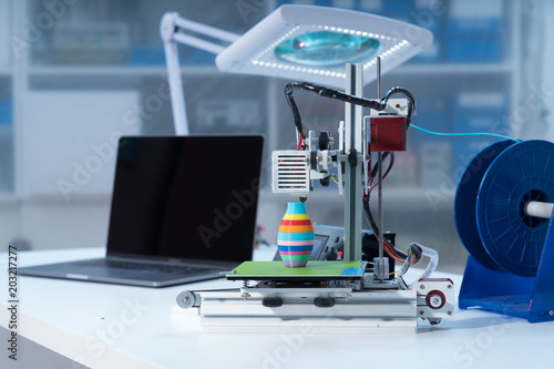 3D printer and computer on the table