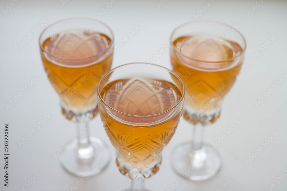 three glass of white or pink wine standing on the table. selective focus three glass of white or pink wine standing on the table. selective focus