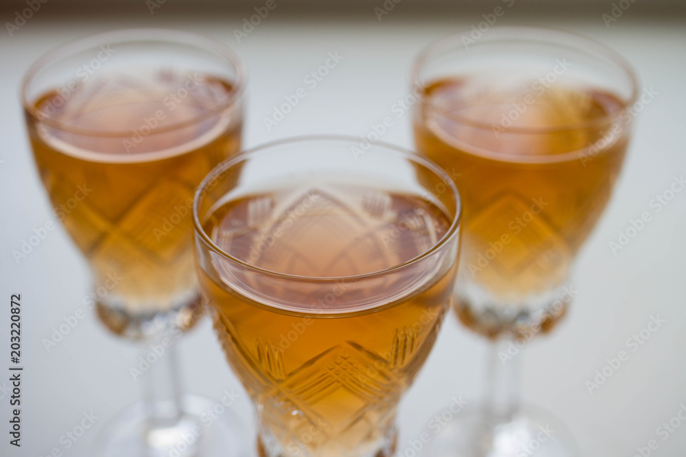 three glass of white or pink wine standing on the table. selective focus three glass of white or pink wine standing on the table. selective focus