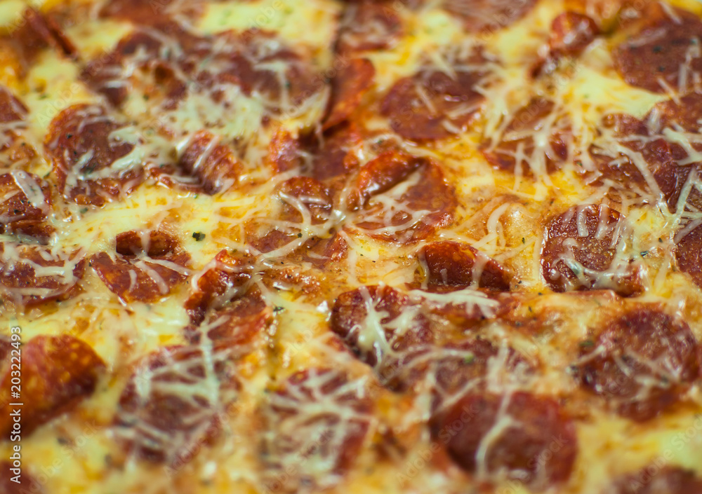 Closeup of tasty slices of pepperoni pizza.