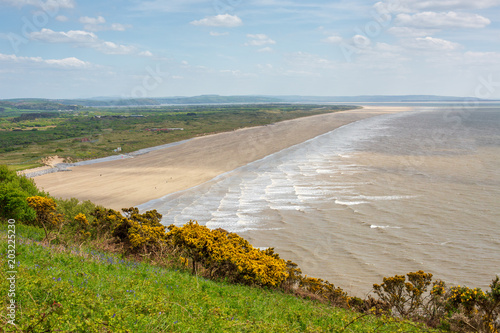 7 Mile stretch of flat beach at Pendine Sands in Carmarthenshire, Wales in the United Kingdom. photo