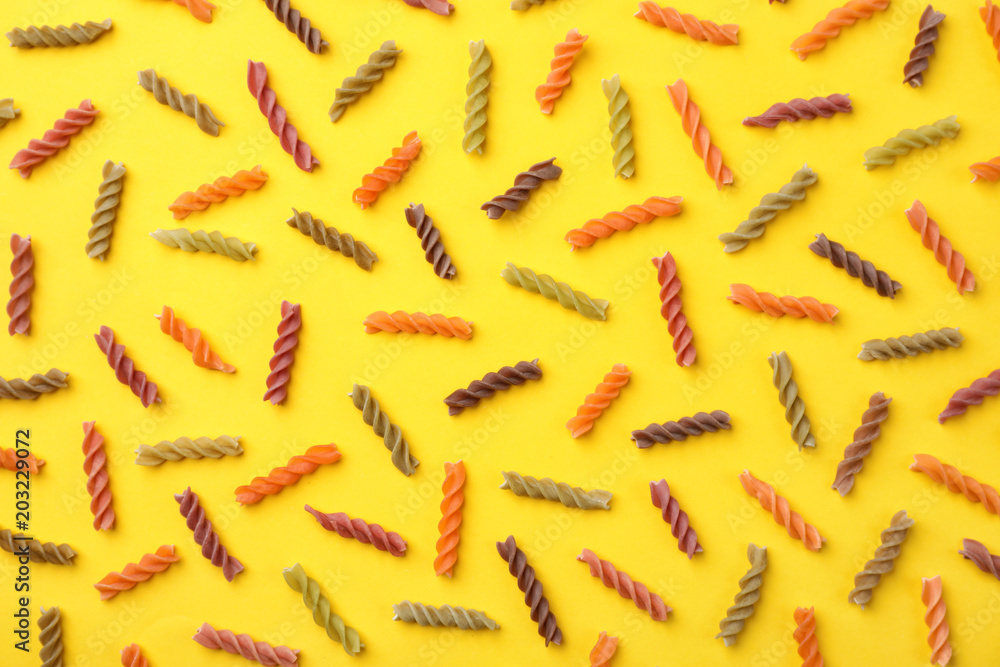 Flat lay composition with raw pasta on color background Flat lay composition with raw pasta on color background