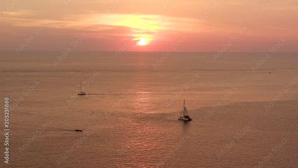 Beautiful sunset on summer day, calm sea wave with boat sailing and fishing boat over sea surface in high view. Beautiful sunset on summer day, calm sea wave with boat sailing and fishing boat over sea surface in high view.