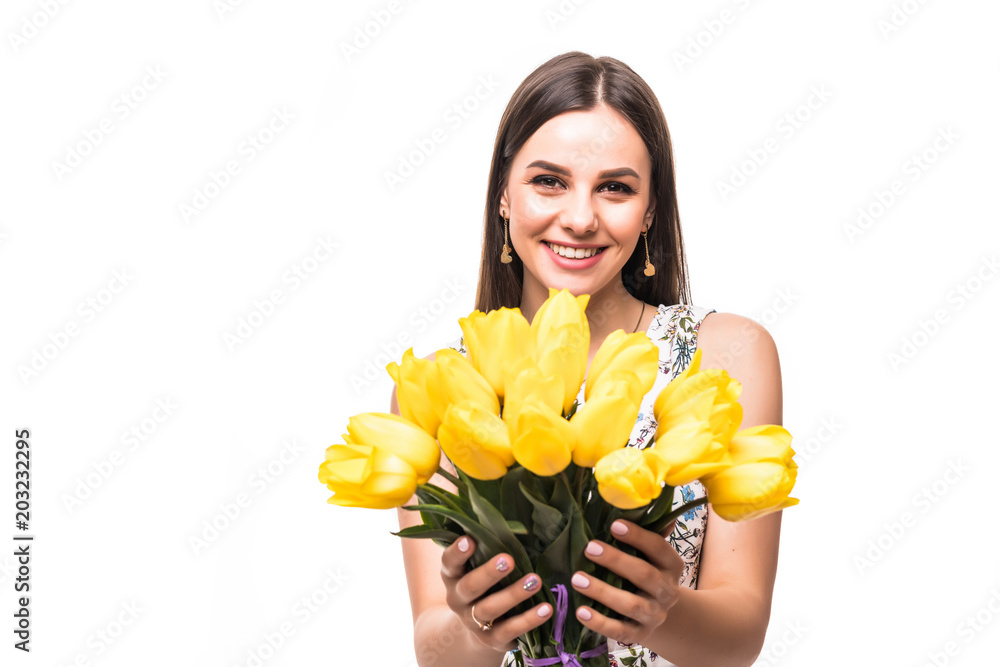 Get gift from boyfriend. Beautiful happy woman in the dress with flowers tulips in hands on a white background Get gift from boyfriend. Beautiful happy woman in the dress with flowers tulips in hands on a white background