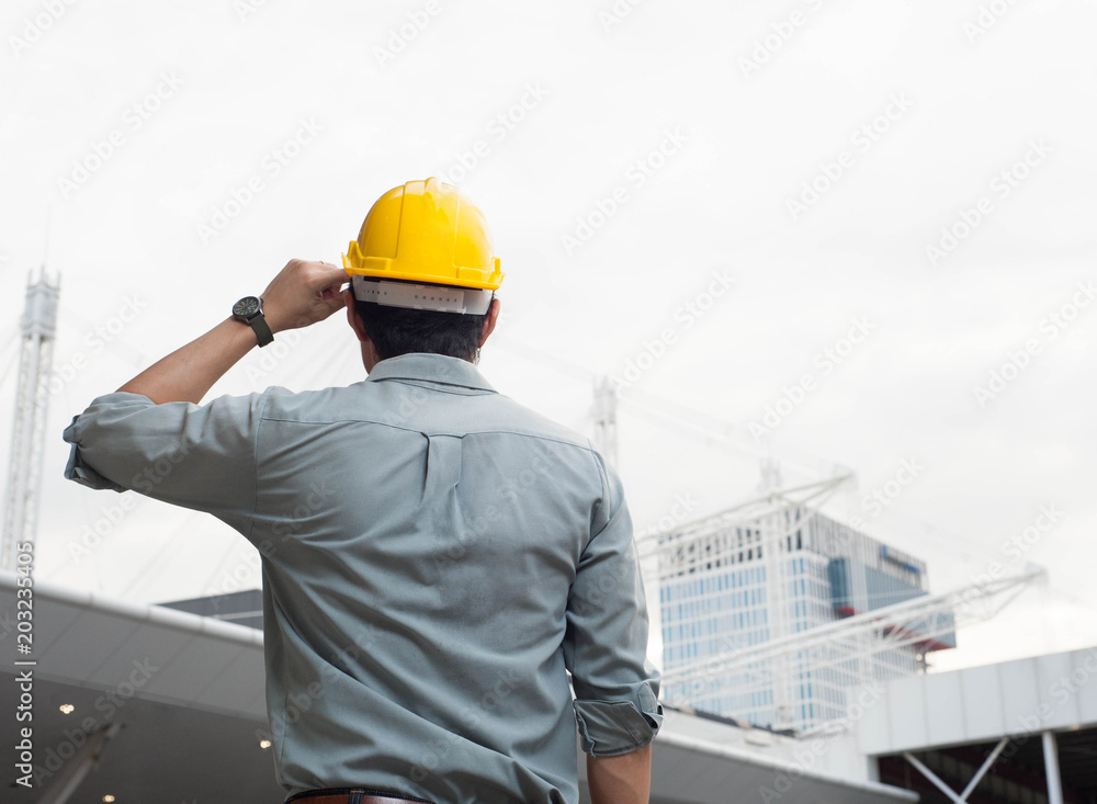 engineer,engineer man,engineer hat,Engineer is looking at the construction,smart engineer on day light background engineer,engineer man,engineer hat,Engineer is looking at the construction,smart engineer on day light background