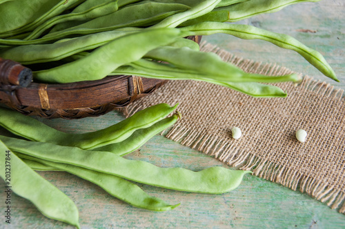 Fresh green pods of flat beans