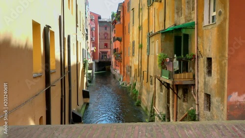 water channel running under buildings of Bologna photo