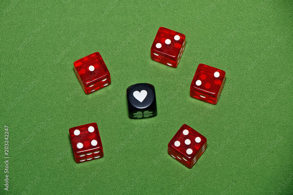 Dices on a green velvet table. Dices on a green velvet table.