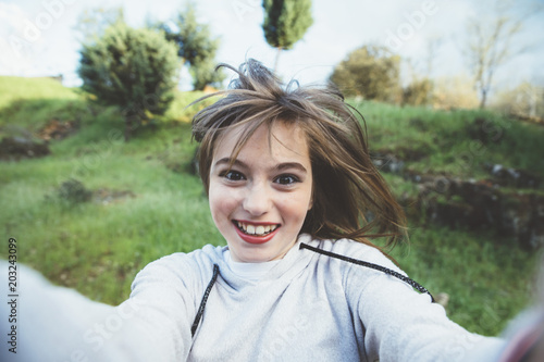 Close-up of young beautiful woman taking selfie
