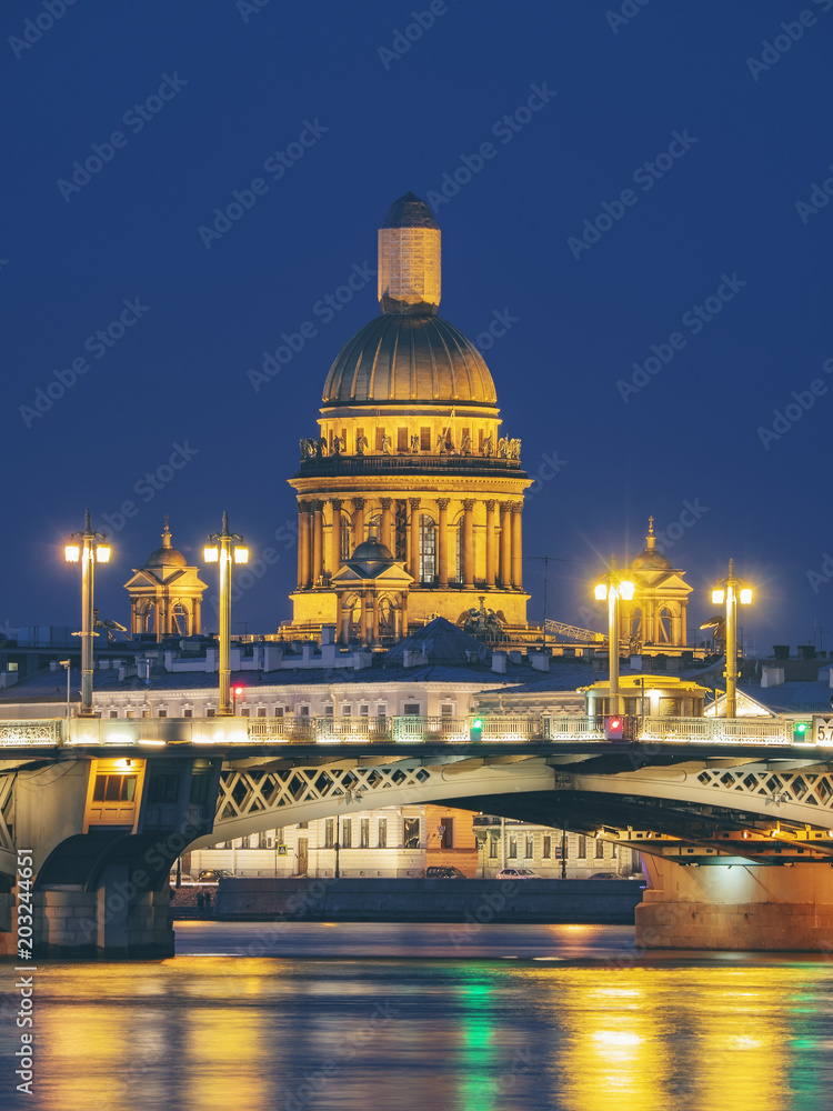 Blagoveschensky or Annunciation Bridge and Saint Isaac Cathedral at night. Saint-Petersburg, Russia