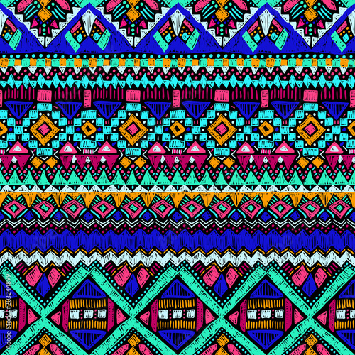 Ethnic pattern. Aztec fabric. Embroidery effect. Tribal ornament. Brazilian or Mexican print. Clothes or interior design. Boho fashion. Traditional homespun textile. Vector seamless pattern.