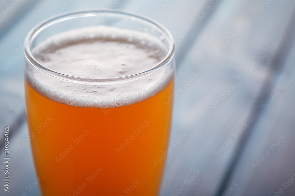 Pale ale on blue wood Pale ale on blue wood