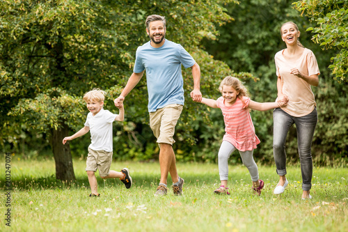 Family with two kids together in summer