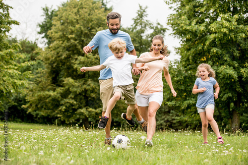 Fototapeta Naklejka Na Ścianę i Meble -  Family playing soccer