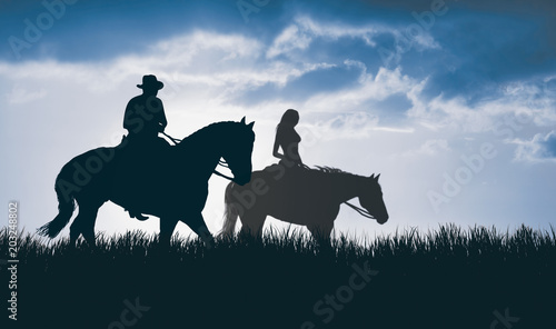 Fototapeta Naklejka Na Ścianę i Meble -  couple on horseback at sunset