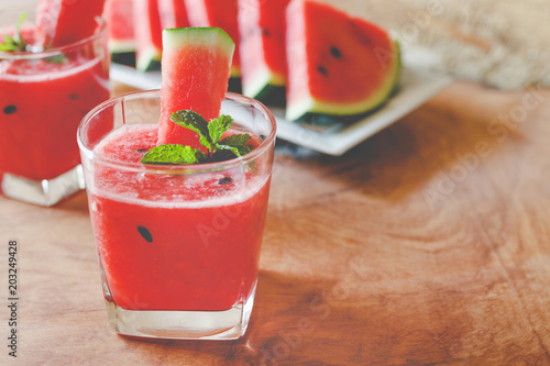 Watermelon drink on wooden background.